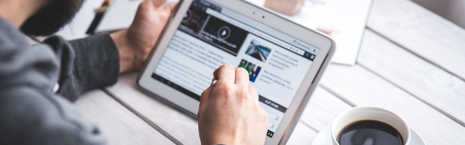 Image of man using touchscreen to prepare for book launch